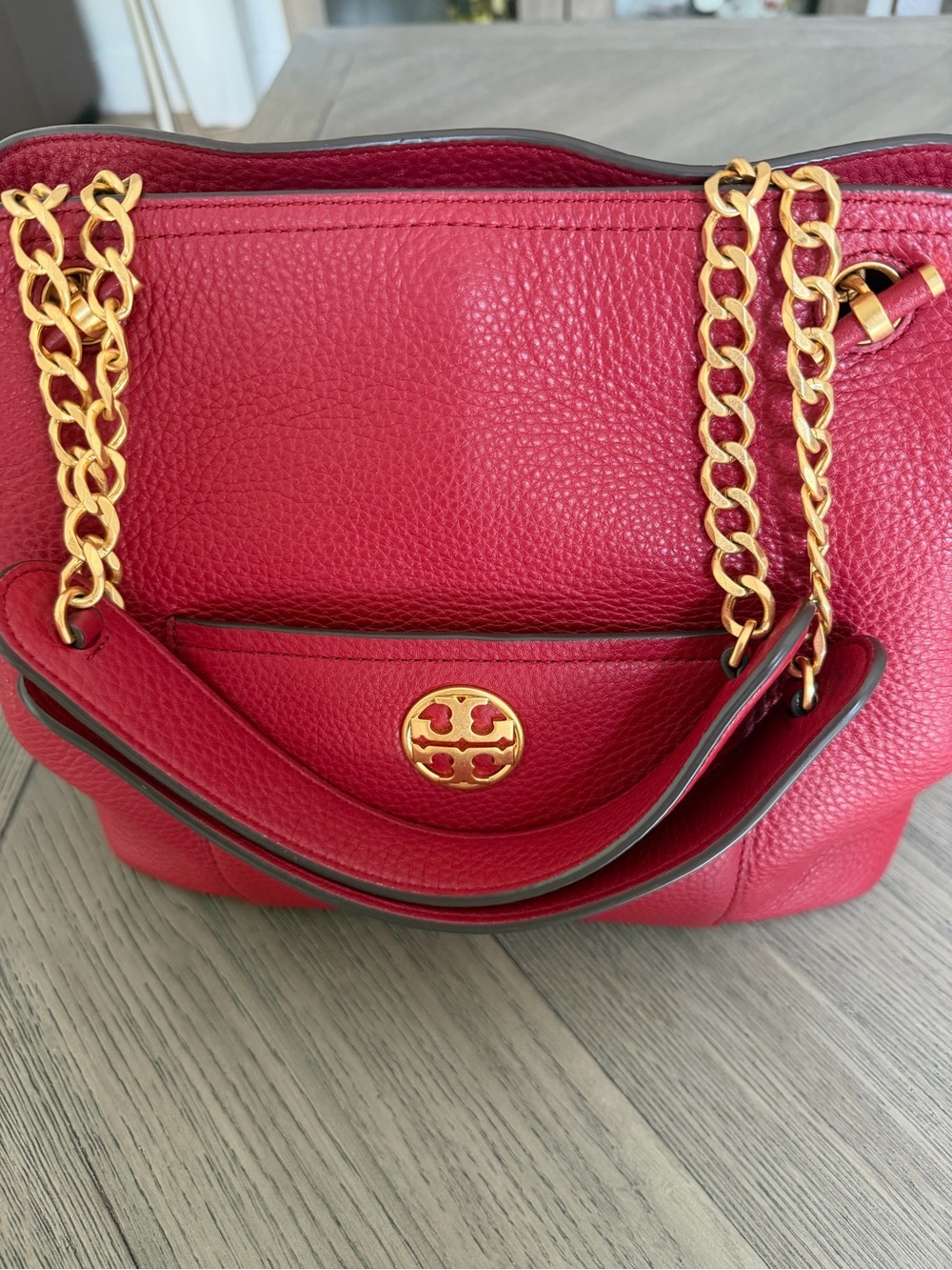 Tory Burch Red Pebbled Leather Satchel with gold tone hardware.